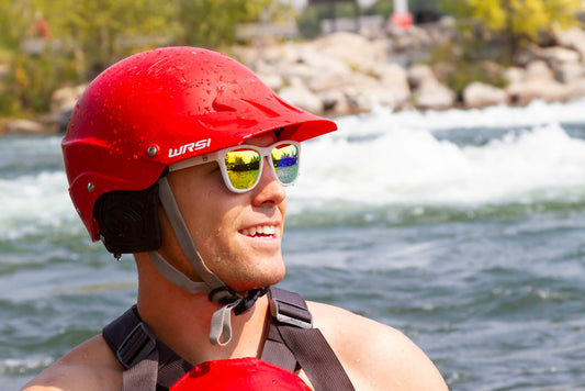 white sunglasses on a smiling kayaker