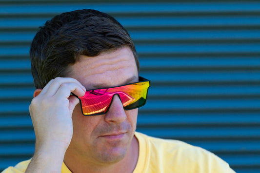 man wearing sunglasses against art background